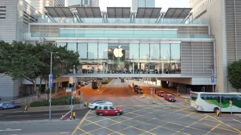 Traffic passing under Apple Store in IFC mall, Hong Kong Stock Footage 309439755