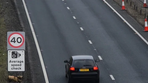 Traffic passing warning sign of average speed cameras uk Stock Footage 88084698