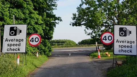 Traffic passing warning sign of average speed cameras uk Stock Footage 91569983