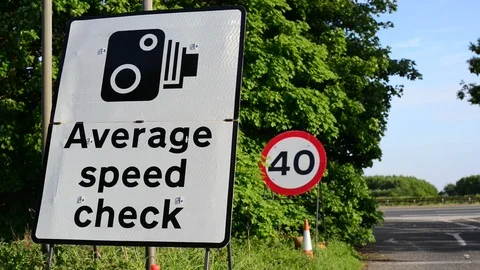 Traffic passing warning sign of average speed cameras uk Stock Footage 91570019