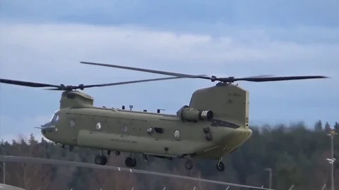 Traffic pattern training flight with hovering Chinook helicopter Video stock 83544409