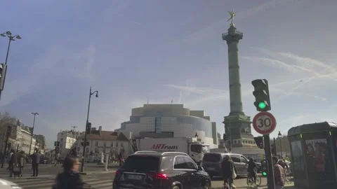 Traffic in Place de la Bastille with column and Opéra in background, Paris Stock Footage 305489422