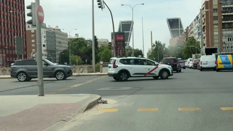Traffic at Plaza de Castilla intersection with EMT bus and KIO Towers in Madrid Stock Footage 337551520
