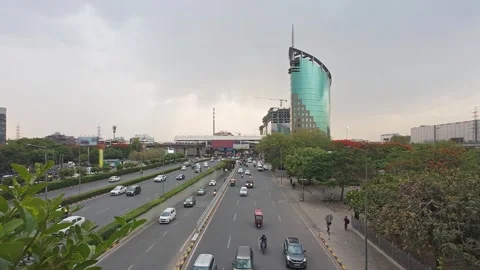 Traffic on Raghvendra Marg with DLF Gateway Tower building at the background. Stock Footage 336663683