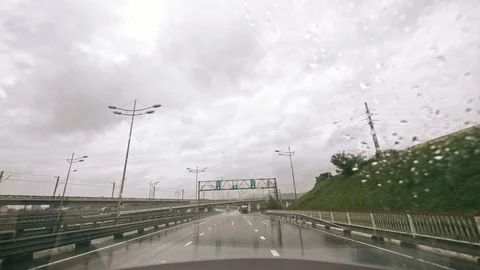 Traffic in Rain from rearview mirror, Driving Car, Storm on Road, Highway, Rainy Stock Footage 82655705