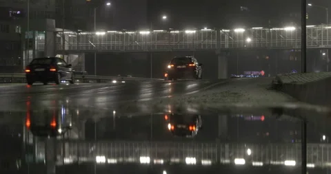 Traffic rain reflection at night Stock Footage 145792371