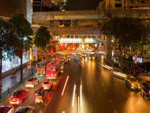Traffic on Ratchadamri Road at night, Bangkok, Thailand, South East Asia, Asia Stock Footage