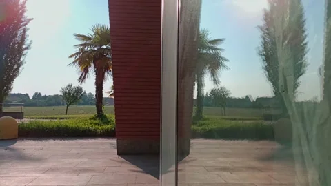 The traffic is reflected in the glass of the building Stock Footage 130980604