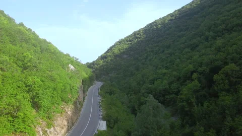 Traffic road between two mountains. Aerial view Video stock 170767599