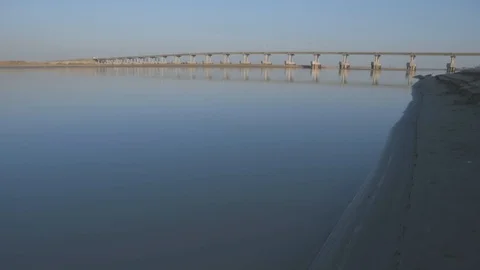 Traffic on the road bridge. Light trucks and trucks moving on a concrete bridge. Stock Footage 106123750