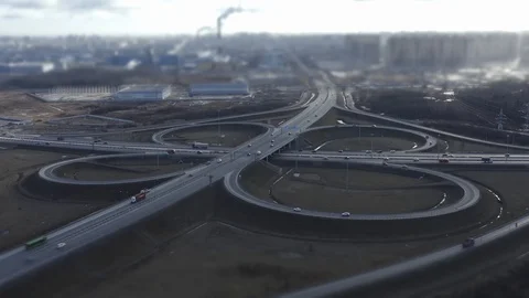 Traffic on road interchange, aerial view. tilt shift effect Video stock 125797220