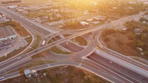 Traffic On Road Interchange And Overpass  Roundabout Highway Transportation Stock Footage 69889103