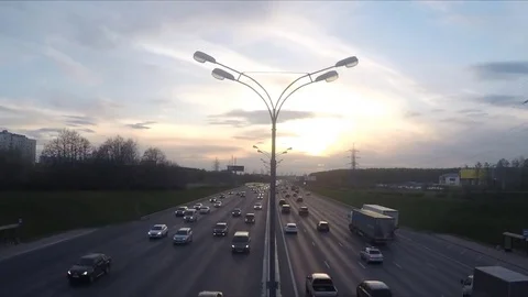 Traffic on the road at sunset timelapse 스톡 동영상 77283898