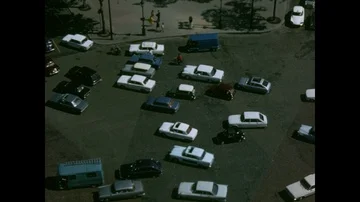 Traffic rotating around the Arch of Triumph, from overhead, Paris, 1970 Video stock 85853501