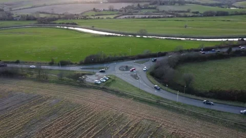 Traffic at a rural roundabout Stock Footage 186650732