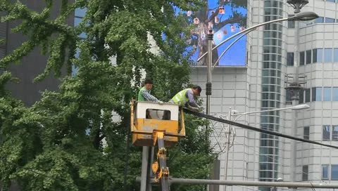 Traffic safety workers Inspecting overhead wires Stock Footage 11133245