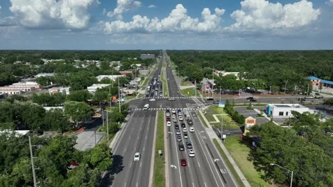Traffic scene on junction of interstate road in suburb of American town. Blue Stock Footage 313025788