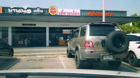 Traffic scene with multiple vehicles urban center parking lot daylight aerial Stock-Footage 336365624