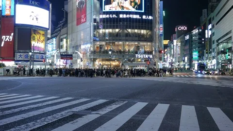 Traffic at Shibuya diagonal scramble intersection at night, Tokyo, Japan Stock Footage 101647127