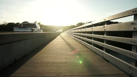Traffic on Side of Highway Walkway During Sunset, Slow Motion Stock Footage 146564196