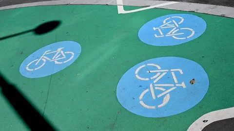 Traffic sign for a bicycle path. Bicycle symbol on the asphalt road. Stock Footage 251958905