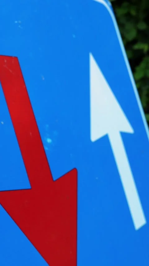 Traffic sign. blue square with red and white arrows. Road works sign. close-up. Stock Footage 310950947