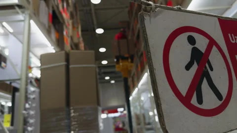 Traffic sign displayed inside building, prohibiting walking in warehouse Stock Footage 272899132