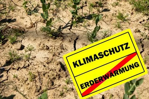Traffic sign on dry ground with German word for climate protection - clima... Stock Photos