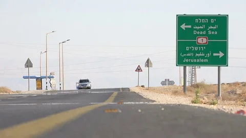 Traffic sign highway between Jerusalem and Dead Sea Stock Footage