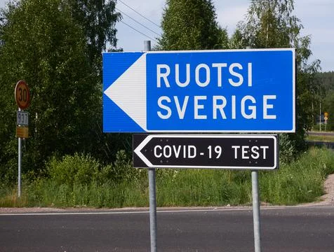 Traffic sign indicating border crossing to Sweden and covid-19 test Stock Photos