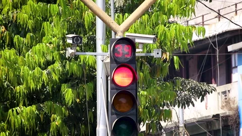 Traffic signal red light countdown timer at urban intersection road safety Stock Footage 332418809
