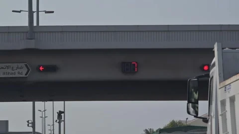 Traffic signals with a countdown timer at an intersection in Ajman, UAE. Stock Footage 347800621