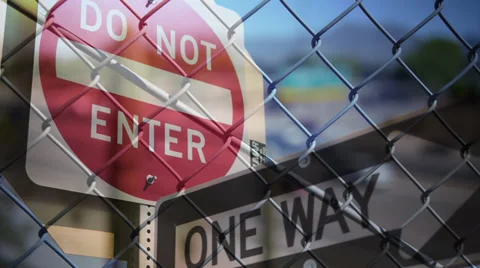 Traffic Signs, Chain Link Fence, and Traffic Overlay Stock Footage