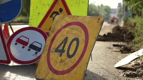 Traffic signs installed in the pile, during road repair Stock Footage 64278071