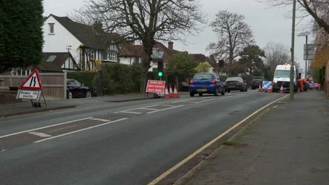 Traffic in single file while utility company making repairs Stock Footage 145908995
