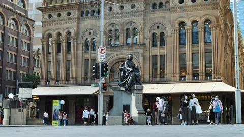Traffic in slow motion passes masked Sydney residents 4K Stock Footage 165975017