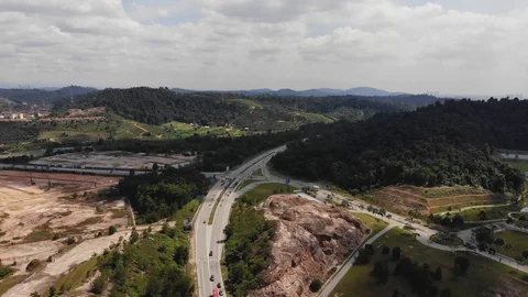 Traffic slow moving intersection junction peak hours in Puncak Alam, Selangor Stock Footage 126981377