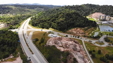 Traffic slow moving intersection junction peak hours in Puncak Alam, Selangor Stock Footage 128187444