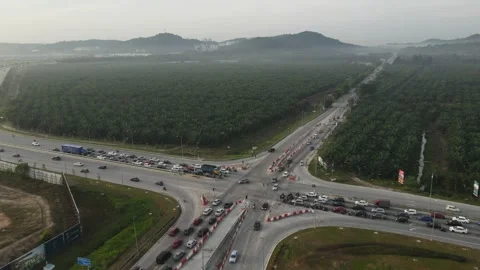 Traffic slow moving intersection junction peak hours in Puncak Alam, Selangor Stock Footage 230363539