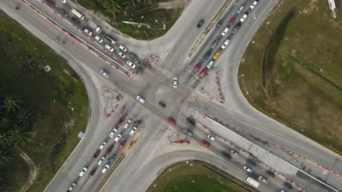 Traffic slow moving intersection junction peak hours in Puncak Alam, Selangor Stock Footage 230363791