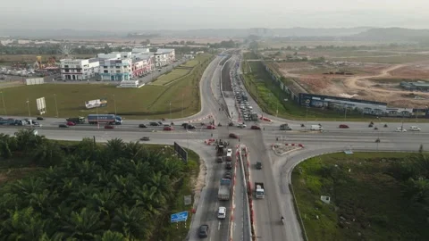 Traffic slow moving intersection junction peak hours in Puncak Alam, Selangor Stock Footage 230364607