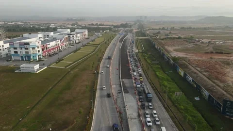 Traffic slow moving intersection junction peak hours in Puncak Alam, Selangor Stock Footage 230364619