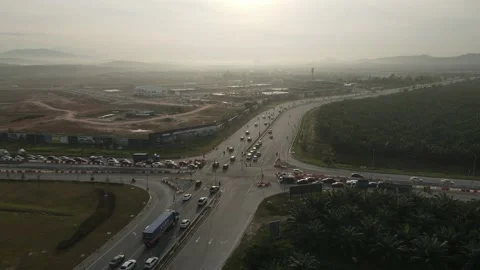 Traffic slow moving intersection junction peak hours in Puncak Alam, Selangor Stock Footage 230365088