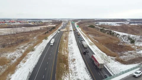 Traffic slows over the overpass as drivers observe the carnage of truck losing Stock Footage 306665294