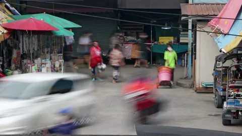 A traffic at a small intersection next to the market, time lapse Stock Footage 223373994