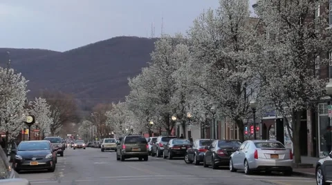 Traffic Small Town Eastern Main street in spring Stock Footage 61833422
