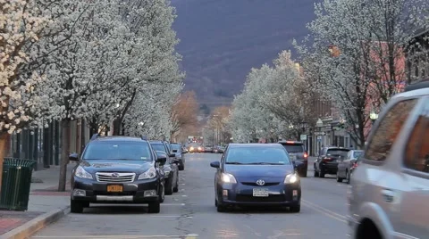 Traffic on Small Town Eastern Main street in spring Stock Footage 61833433