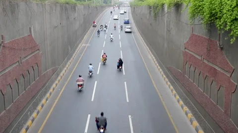 Traffic smoothly passing through the underpass in the evening. Stock Footage 161268706