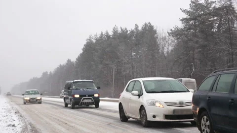 Traffic in the snow storm. Video stock 98423228