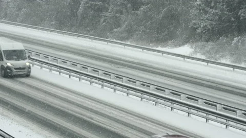 Traffic on a snowy highway Stock Footage 144324925